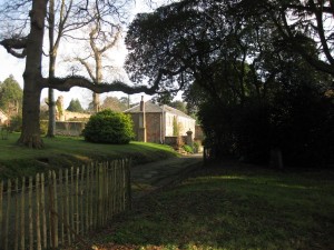 The road leading to the Gamekeeper's Cottage and the courtyard GK from the road cut 900